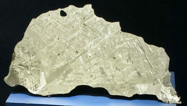 A slice of Gibeon iron meteorite showing the intricate Widmanstätten patterns.